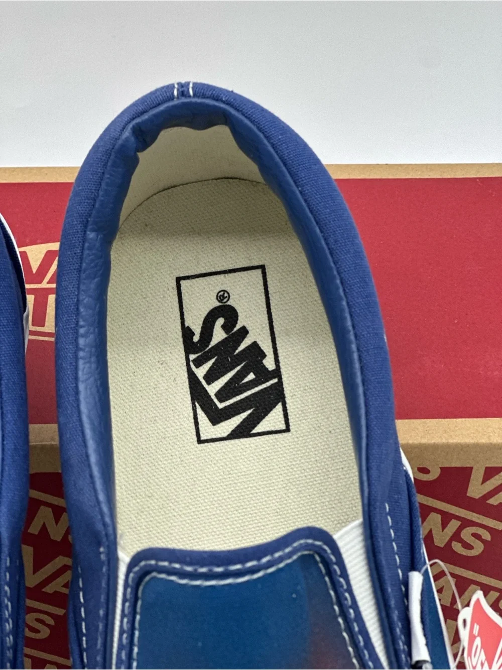 Vans Blue Plaid Slip-On Sneakers with Orange Accent